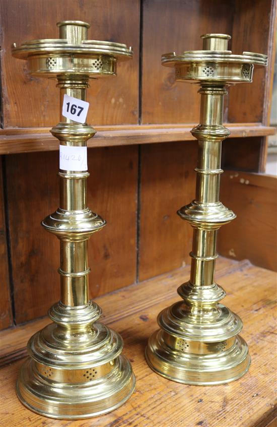 A pair of brass church candlesticks